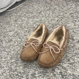 Moccasin UGGS with light pink ribbon. Size 7 gently worn.